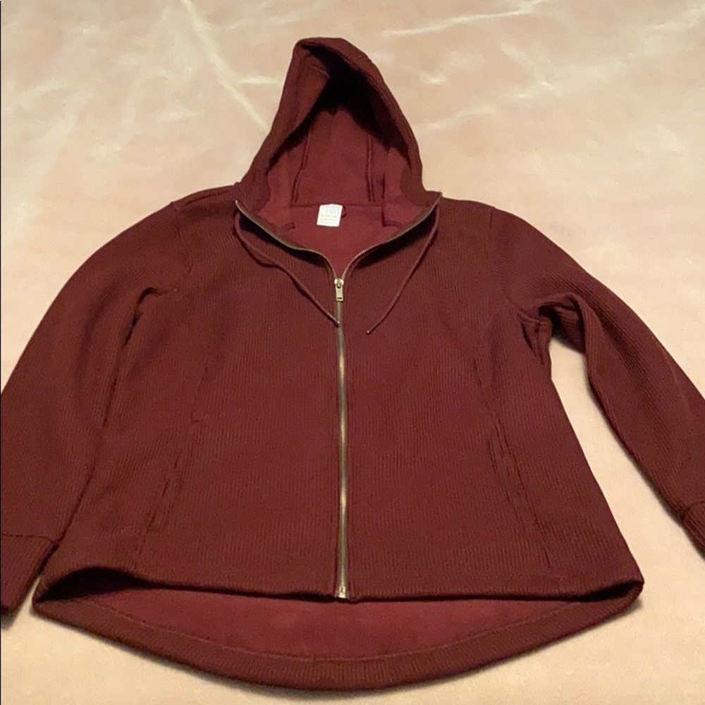 Burgundy zip warmup jacket.
